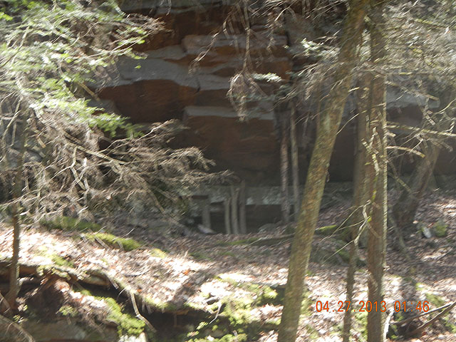 poe trip 04-26-2013 020.jpg -                                Couldn't figure why anyone would prop logs against this rock formation but it made us curious enough to check it out.